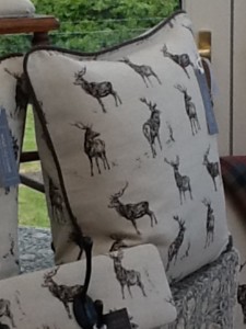 18" feather filled cushion in Milton & Manor Mini Stag Parade Linen fabric with co-ordinated piped edge in Clarke and Clarke Henley Cotton/Linen mix fabric in Liquorice £45.00 per cushion, excludes P&P